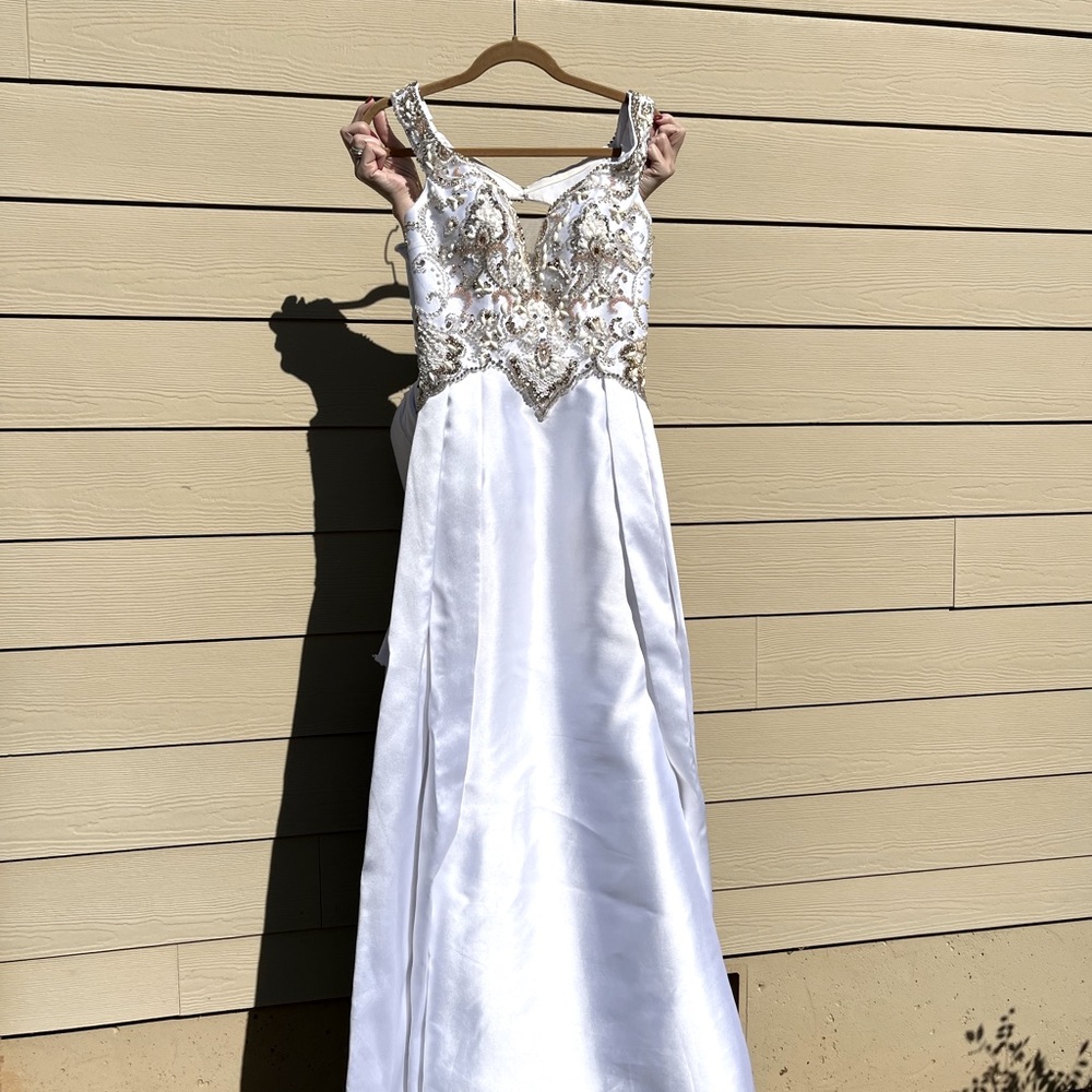 Pageant dress. Brand is Panoply, size 4, no alterations and only worn once.